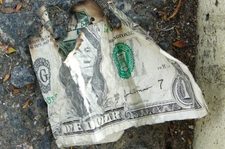 tattered dollar bill