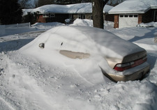 snow buried car