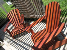 adirondack chairs under a pergola