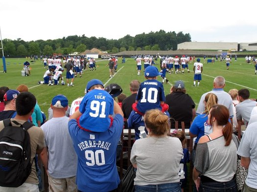 people watching the Giants practice at UAlbany