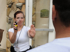 woman spraying pepper spray