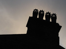 chimneys silhouetted by Flickr jayneandd