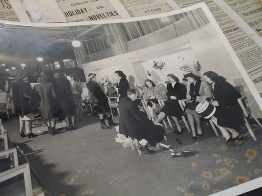 frear building historical photo women trying on shoes