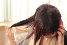 asian woman playing with her hair