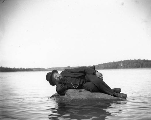 charles steinmetz on a rock in thompson's lake