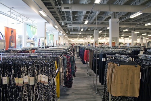 Men's clothing is displayed for sale inside a Nordstrom Rack store