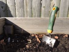 garden shovel in dirt