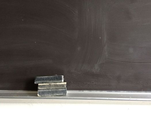 erasers on chalkboard