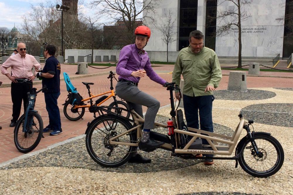 E-bikes_person_on_cargo_bike.jpg