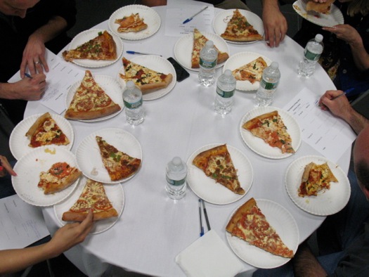 16 slices of pizza on judges table