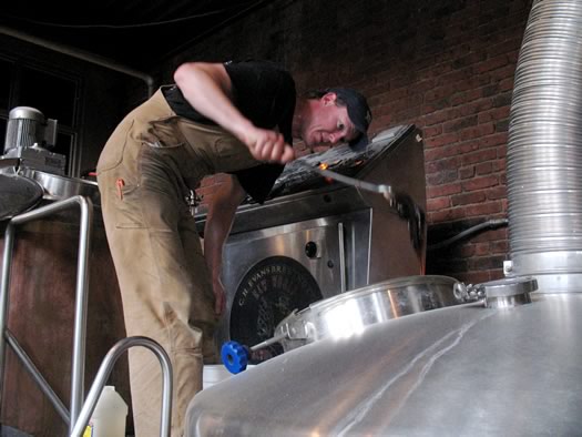 ryan demler adding invert sugar to a tank