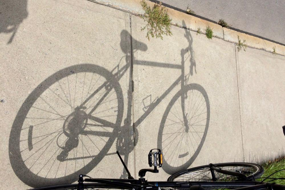 bike shadow on sidewalk