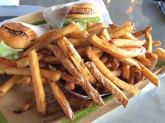 burger_tasting_fries_burgerfi.jpg