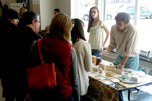 cheese traveler eric paul helping customers