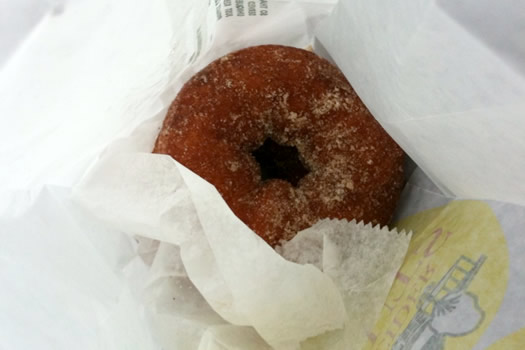 cider donut nestled in bag