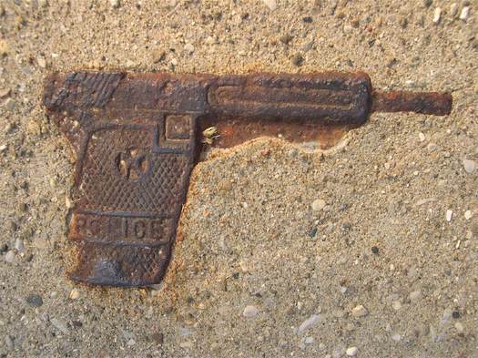 gun encased in concrete