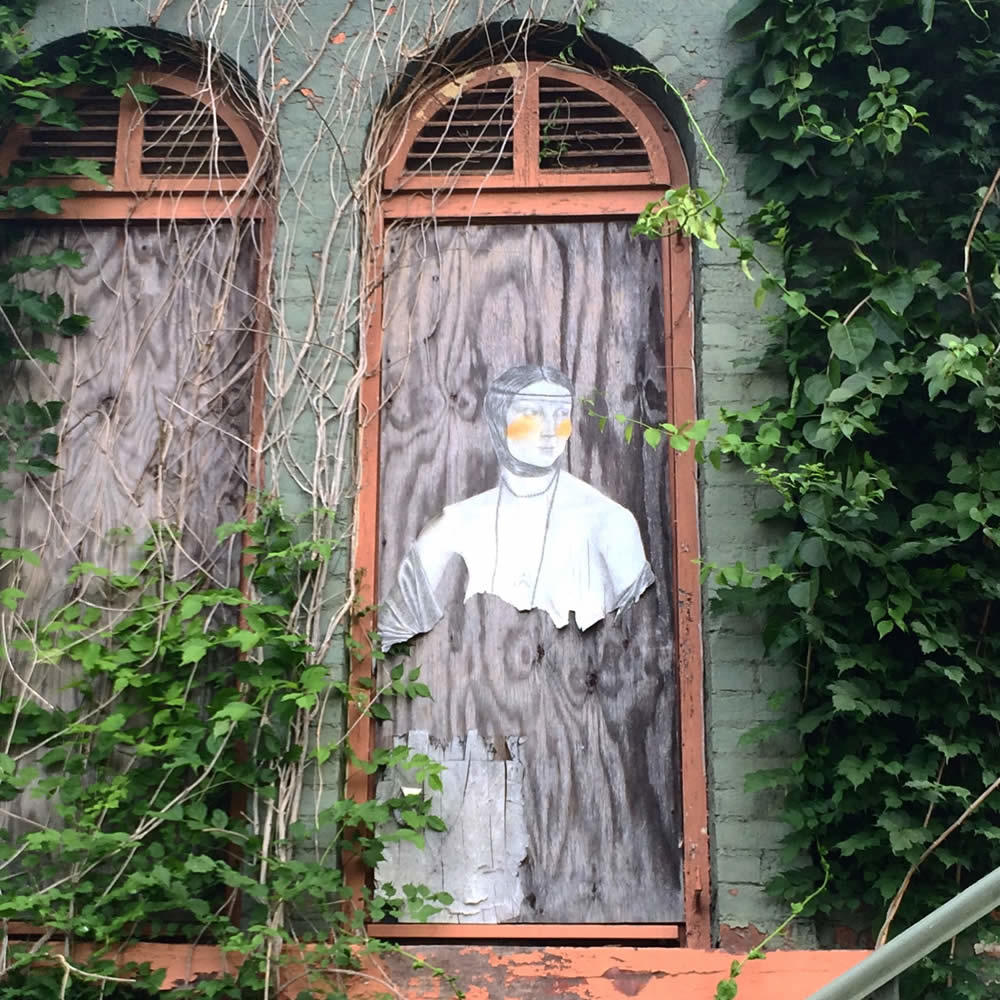 lady in the window Church of Holy Innocents building