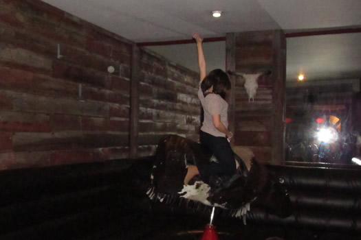 mechanical bull city beer hall person riding