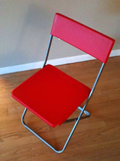 one red foldup chair