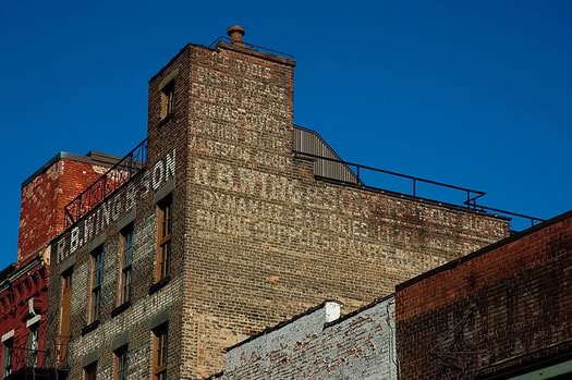 rb wing and son building ghost sign