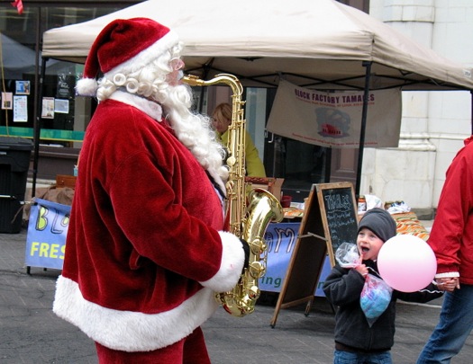 santa playing sax troy victorian stroll