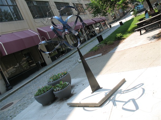 sculpture in the streets at arcade building