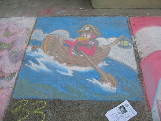 sidewalk art bird in a boat