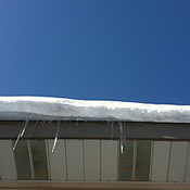 snow hanging from roof