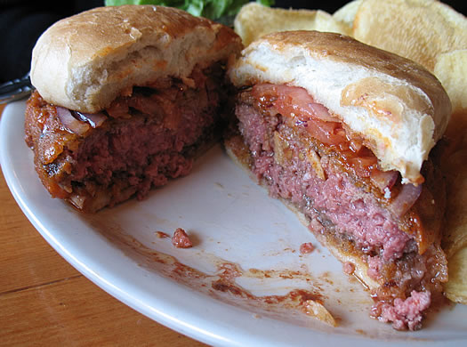 swifty's deep fried burger cut in half