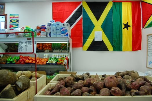 west indian grocery tubers veggies flags