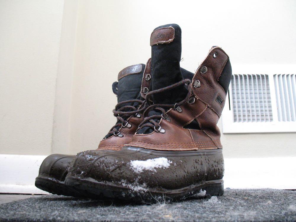 winter boots with snow on them